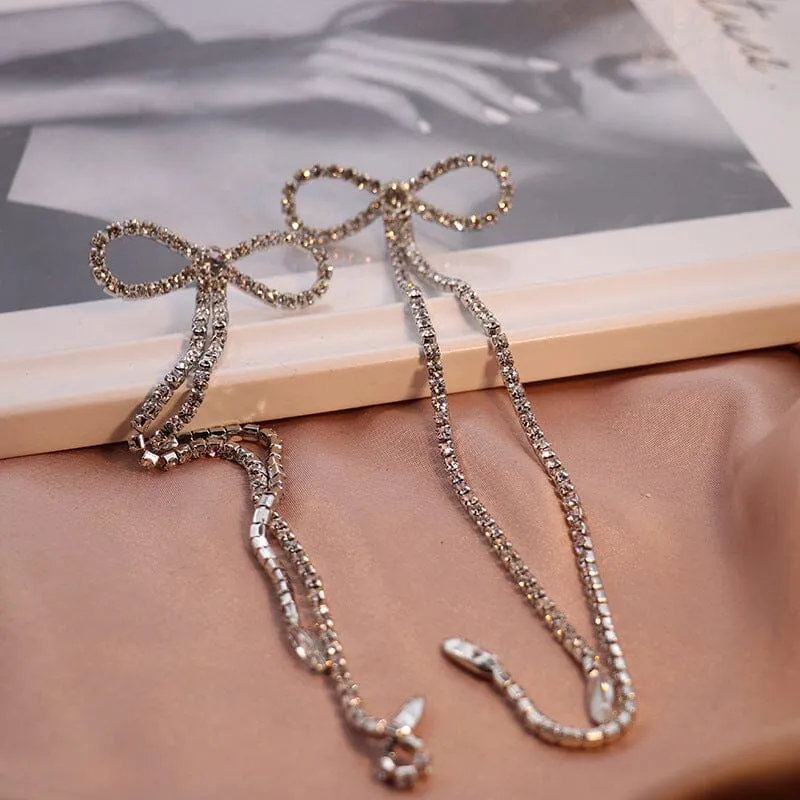 RHINESTONE BOW LONG CHAIN EARRINGS IN WHITE Gloria Lanvin